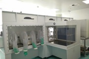GMP manufacturing using an isolator to decrease cost and increase product safety